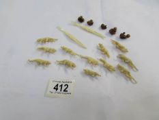 a collection of small bone animal/tiger figures, seated figures and 2 other items.