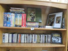 2 shelves of CD's and DVD's.