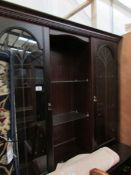 A mahogany effect wall unit.