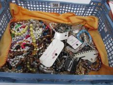 A tray of costume jewellery including necklaces etc.