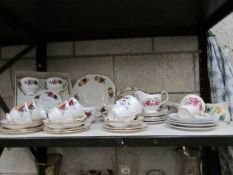 A shelf of assorted tea ware.