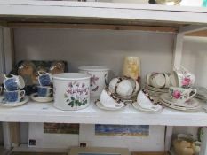 A shelf of miscellaneous including Portmerion planters, child's tea set etc.