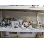 A shelf of miscellaneous including Portmerion planters, child's tea set etc.