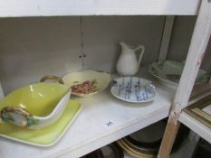 A strainer bowl on stand, 3 other dishes and a jug.