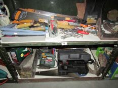 2 shelves of assorted tools.