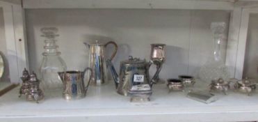 A mixed lot of silver plate and 2 glass decanters.