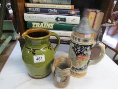 A beer stein, a jug and a vase,