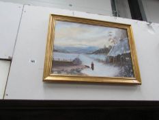 A gilt framed winter scene.