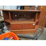 A teak television stand.