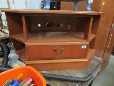 A teak television stand.