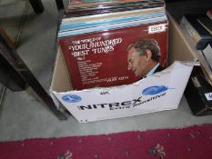 A box of approximately 50 LP records including classical.