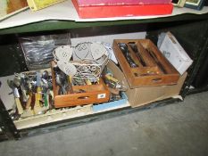 A shelf of assorted cutlery.