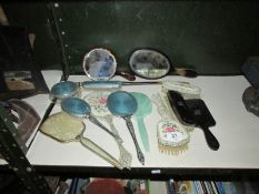 A quantity of vintage hand mirrors, brushes etc.