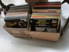 2 boxes of assorted LP records.