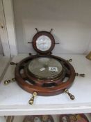 2 ship's wheel shaped barometers.