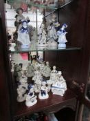 A quantity of blue and white figures.