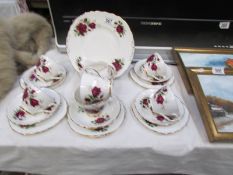 A 21 piece Colclough rose decorated tea set.
