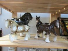 4 large ceramic horses.