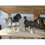 4 large ceramic horses.