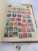 An album of UK and foreign stamps.
