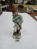 A continental porcelain figure of a soldier.