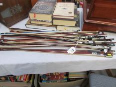 Approximately 19 violin bows in various lengths, some require re-stringing.
