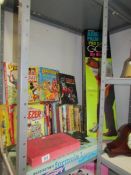 A shelf of vintage children's books and games including Waddington's Formula 1, Spy Ring,