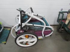 A bicycle trailer for a child.