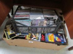 2 boxes of tapes, CD's and games.