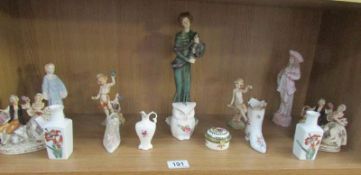A shelf of figures etc.