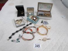 A mixed lot of costume jewellery including necklaces, brooches, earrings etc.