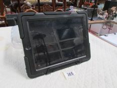 An Apple Ipad with heavy duty Griffin case.