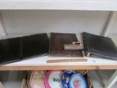 A shelf of vintage desk top items.