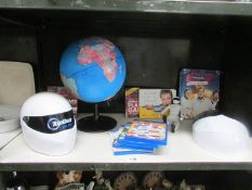 A shelf of Top Gear collectables and a table globe.