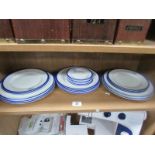 A set of 24 plates by Harrods in white with blue edging and lion emblem with latin motto 'Fide Sed