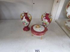A Limoges trinket pot and a pair of vases.