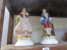 A pair of continental porcelain figures.