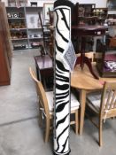 A 'Gewel Mattex' zebra patterned rug, 229 x 160 cm.