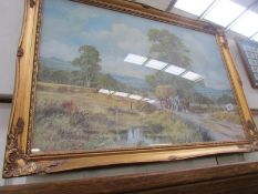 A gilt framed and glazed farming scene.