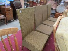 A set of 4 Lloyd loom style chairs.