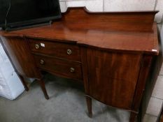 A mahogany inlaid sideboard.