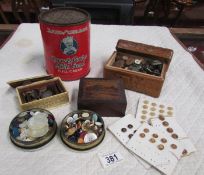 A quantity of tins and boxes of old buttons.