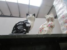 2 pottery cats.