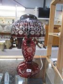 A large ruby cut glass table lamp.