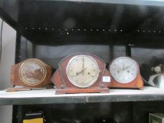 3 mantel clocks.