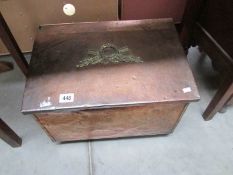 A copper log box.