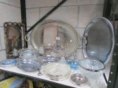 A shelf of assorted silver plate etc.