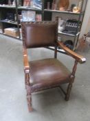 An oak elbow chair,.