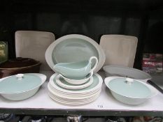 A shelf of Wedgwood dinner ware etc.