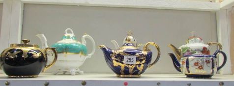 6 teapots including gilded examples.